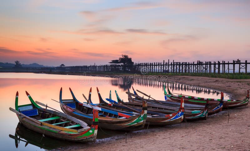 Wooden boat in Ubein Bridge at sunrise, Mandalay, Myanmar