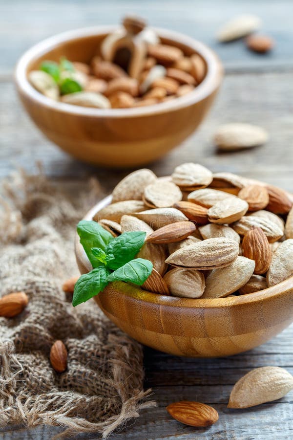 Wooden bowls with almond nuts.