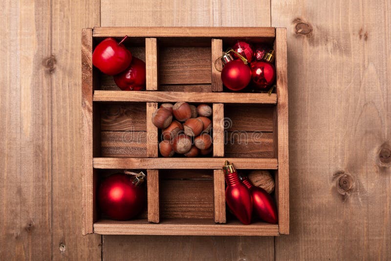 Wooden Box with Christmas Decorations on Wooden Table. Stock Photo