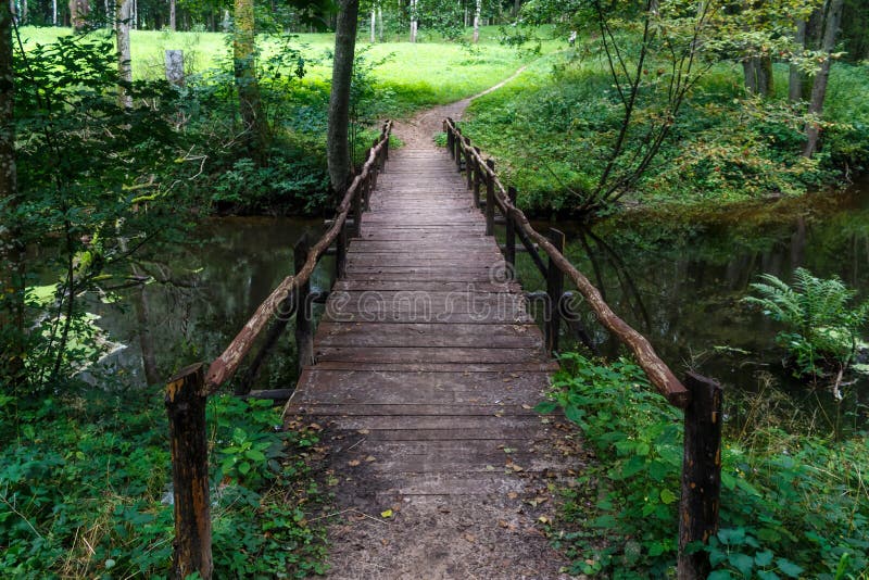 Wooden Bridge Over The River In The Stock Photo Image Of Outdoors