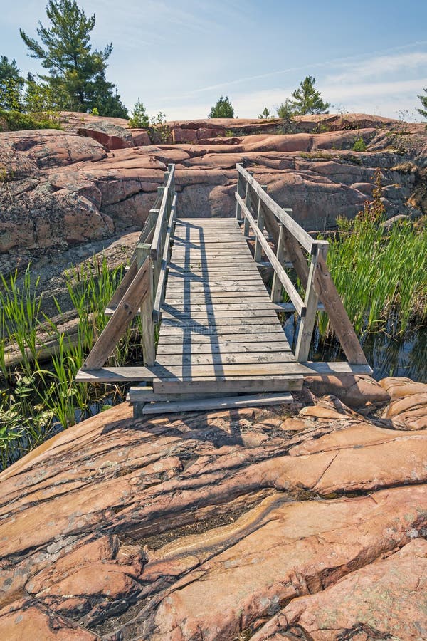 Wooden Bridge over Rock Outcrops stock images Wooden Bridge over Rock Outcrops stock images