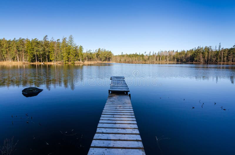 Wooden bridge to the middle of the lake