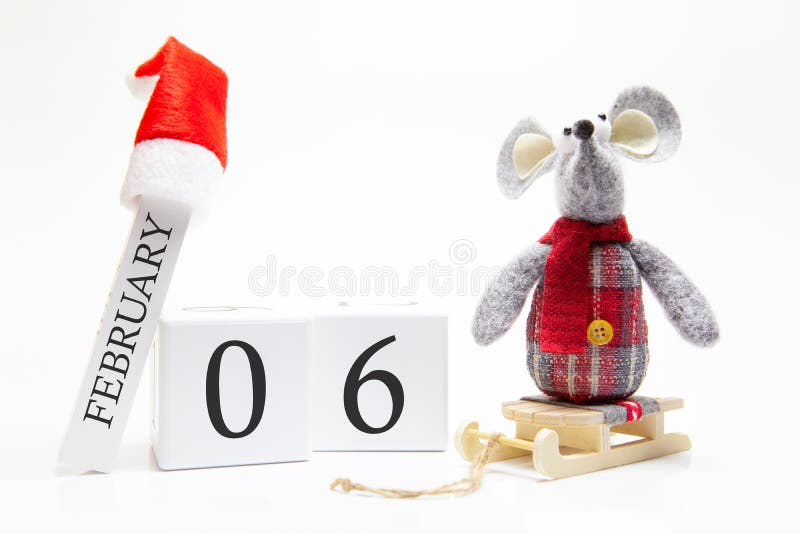 Wooden calendar with number February 6. Happy New Year! Symbol of New Year 2020 - white or metal silver rat. Christmas decorated stock images Wooden calendar with number February 6. Happy New Year! Symbol of New Year 2020 - white or metal silver rat. Christmas decorated stock images