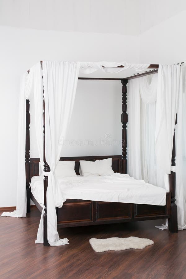Wooden Canopy Bed and a White Hide on the Floor Stock Photo Image of cover, large 34053662
