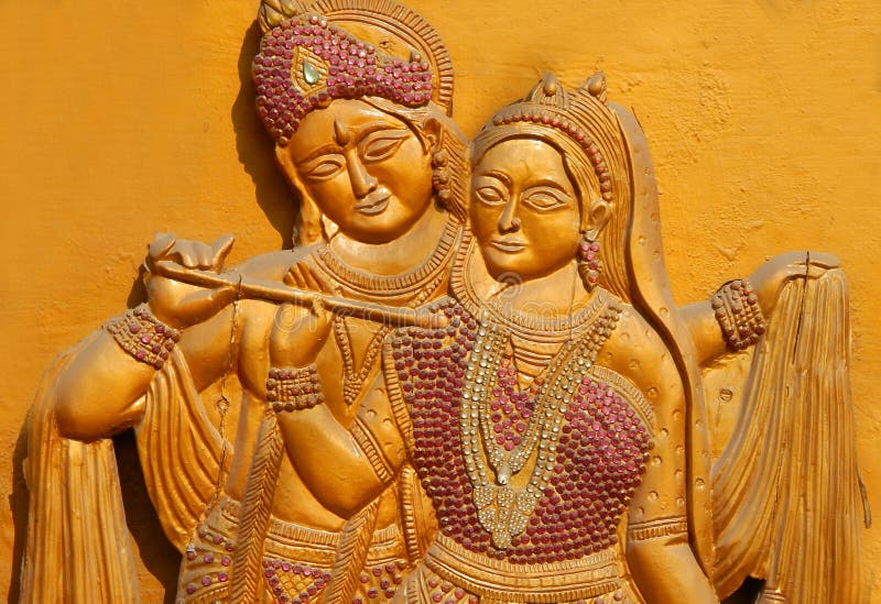 Wooden carving of Hindu god Sri Krishna and Goddess Radha stock image