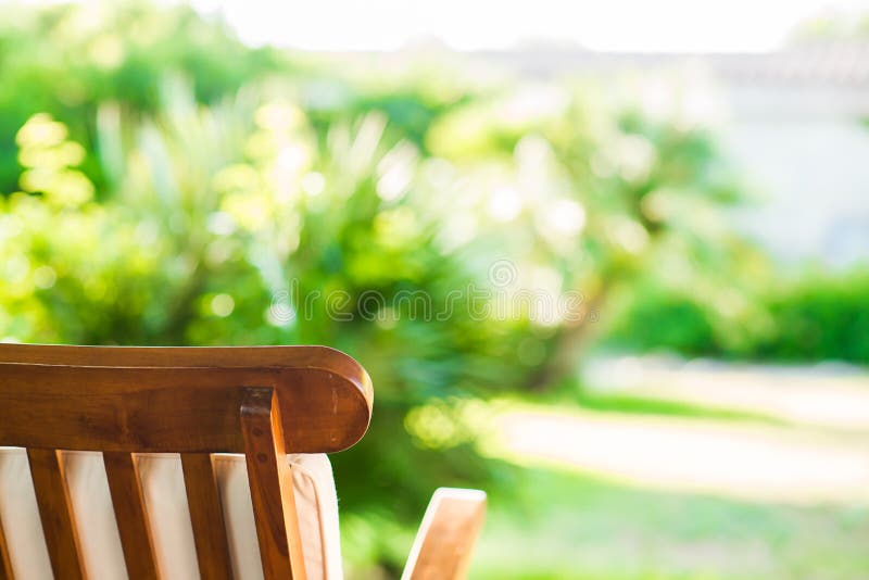 Wooden Chair on Blurred Background in Garden. Abstract Bokeh Light Stock  Image - Image of bright, relax: 189994505