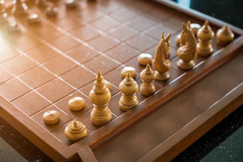 Wooden Chess Board Game with Chess Pieces Ready To Play Stock Photo