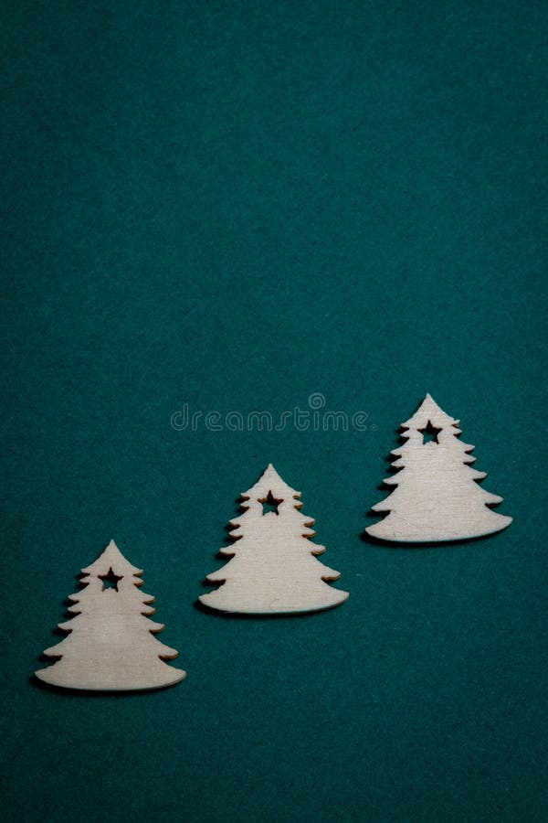 Wooden Christmas trees on Christmas green background stock images Wooden Christmas trees on Christmas green background stock images