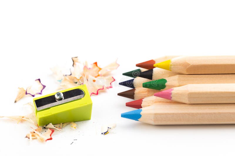 Colored pencils with sharpener Stock Photo by rezkrr
