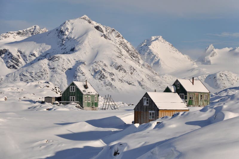 Wooden colourful cottages in winter