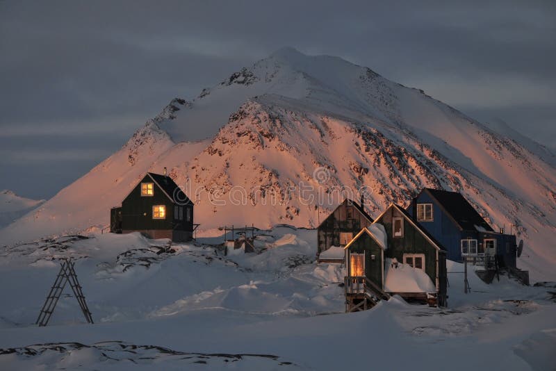 Wooden colourful cottages in winter