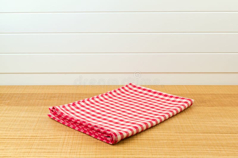 Wooden counter with red checked tablecloth for product montage background royalty free stock image