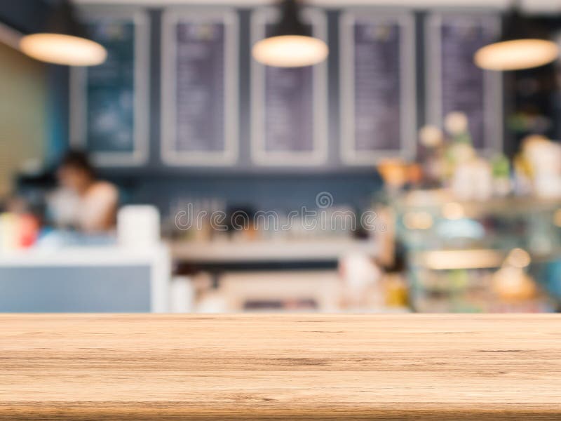 Wooden counter top with bakery shop background royalty free stock photography