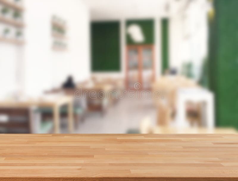 Wooden counter top with restaurant blurred royalty free stock image
