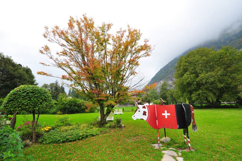 Wooden cow with red Swiss ensign in Interlaken