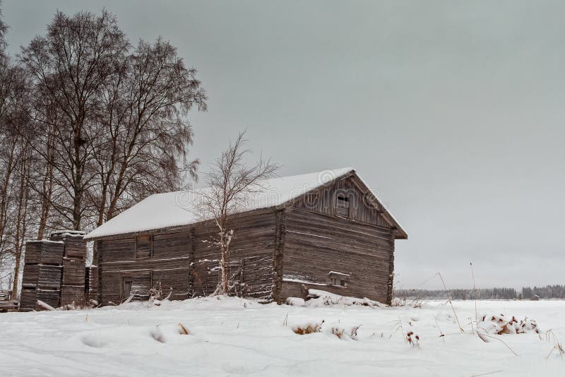 Wooden Crates By An Old Barn. Wooden crates have been piled by and old barn house in the rural Finland. The snow has covered the barn and the crates royalty free stock photos Wooden Crates By An Old Barn. Wooden crates have been piled by and old barn house in the rural Finland. The snow has covered the barn and the crates royalty free stock photos