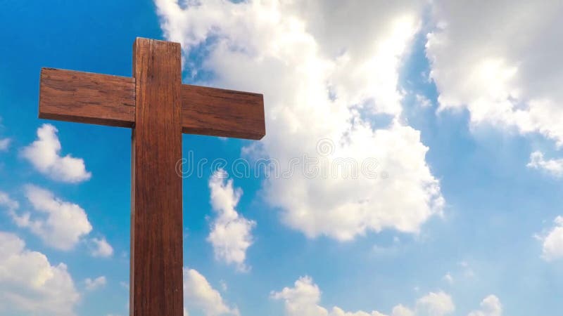 Wooden cross on the blue sky cloudy