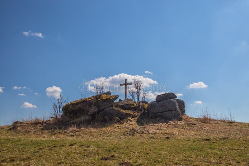 Wooden cross on a stone hilltop stock photography Wooden cross on a stone hilltop stock photography