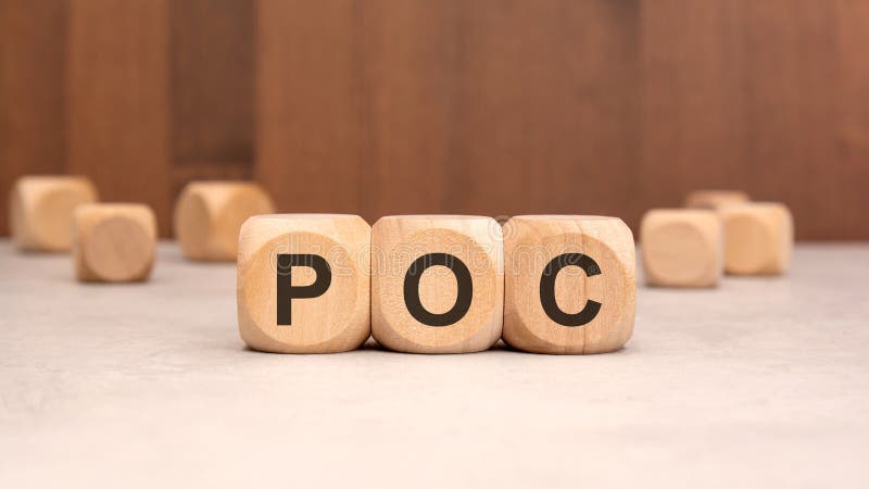 Three wooden cubes with the letters POC are placed in a row on a light concrete surface, with other blurred cubes scattered in the background. Perfect for Proof of Concept. Poc test stock images, royalty-free photos and pictures