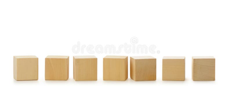 Wooden cubes in row royalty free stock photography