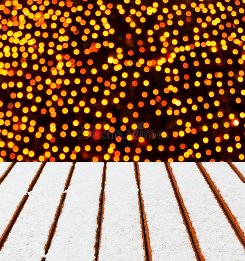 Wooden deck with snow and Christmas lights background. royalty free stock images Wooden deck with snow and Christmas lights background. royalty free stock images