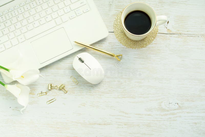 Wooden desk table with laptop computer, coffee cup and mouse. Floor plan. stock photography