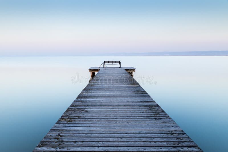 Wooden dock near the sea with the fog in the background. A wooden dock near the sea with the fog in the background stock photos Wooden dock near the sea with the fog in the background. A wooden dock near the sea with the fog in the background stock photos