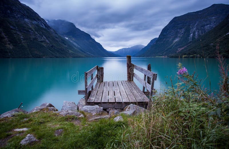 Wooden dock at norwegian lake