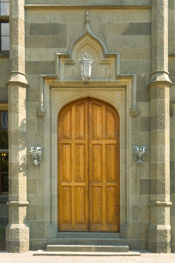 Wooden door in castle stock images