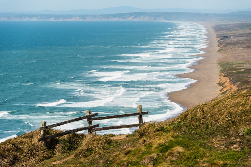 Wooden fence on a cliff by the Pacific Ocean