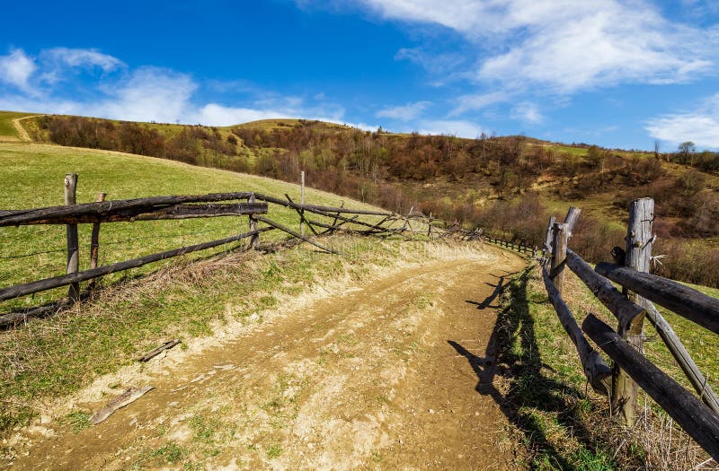 Wooden fence by the road in rural area