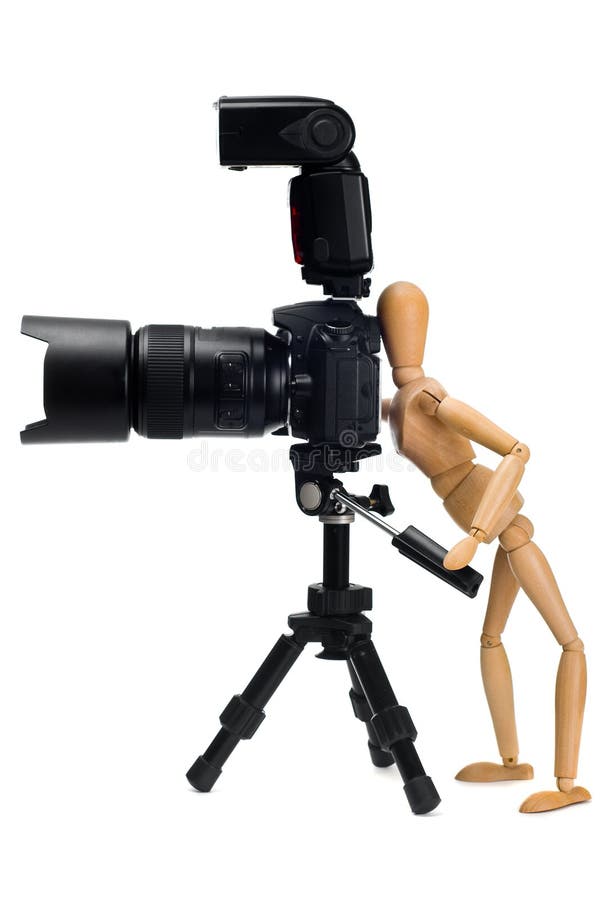 The wooden figure of photographer