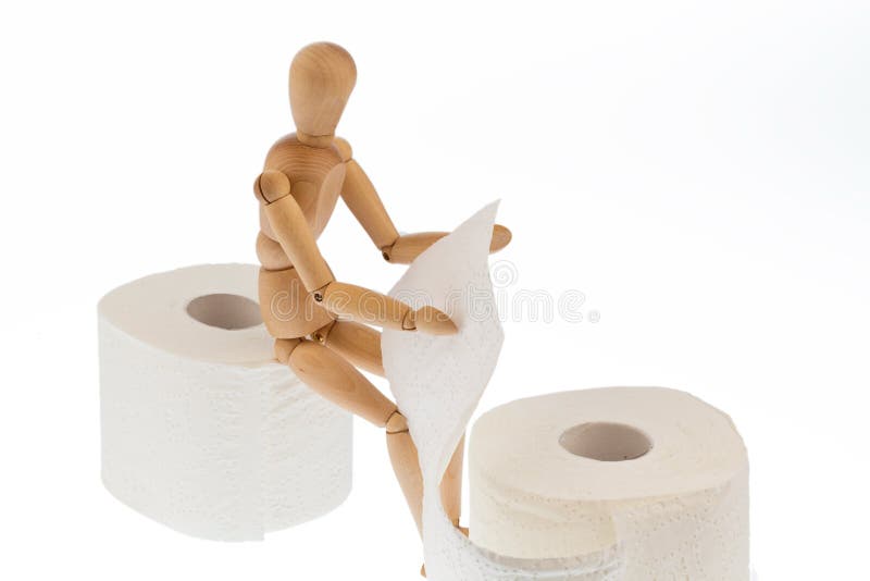 Wooden figure on a roll toilet paper