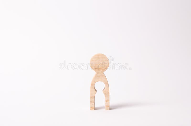 A wooden figure of a woman with a void inside in the shape of a child. The concept of the loss of child, abortion of pregnancy