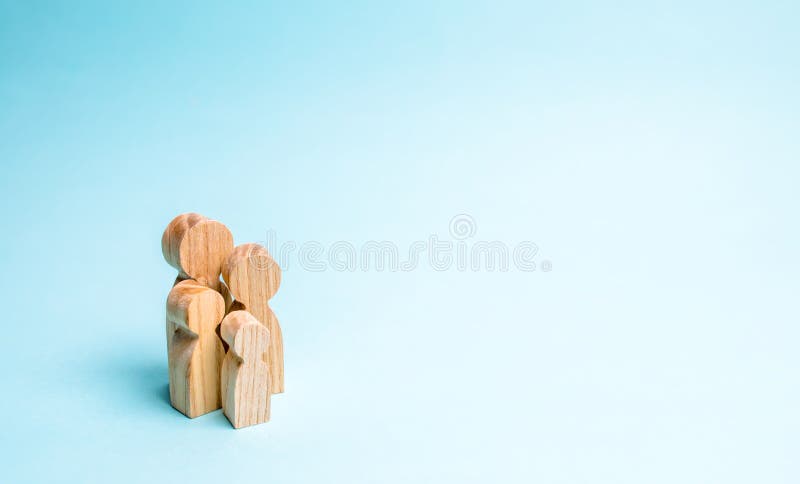 Wooden figurines of the family stand on a blue background. The concept of a classic traditional family. values, unity, loyalty, stock images Wooden figurines of the family stand on a blue background. The concept of a classic traditional family. values, unity, loyalty, stock images
