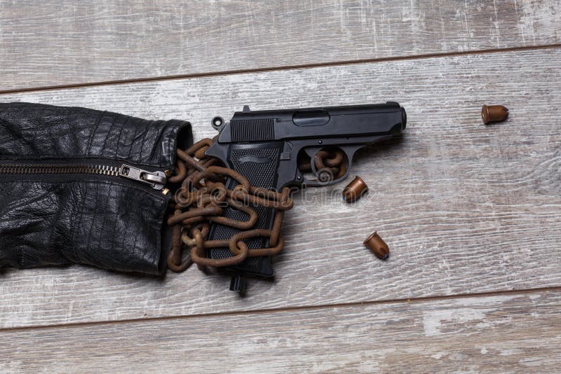 On The Floor Is A Leather Jacket A Chain Cartridges A Pistol And Two Knives  Stock Photo - Download Image Now - iStock