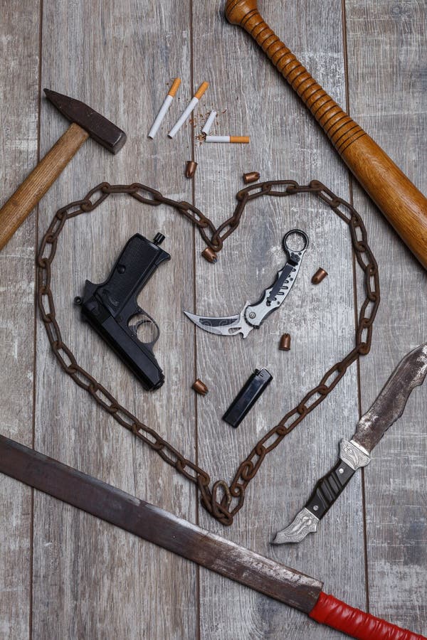 On The Floor Is A Leather Jacket A Chain Cartridges A Pistol And Two Knives  Stock Photo - Download Image Now - iStock