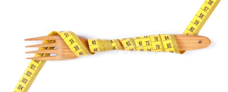 Wooden fork wrapped in centimeter on white background, concept of lose weight and healthy lifestyle royalty free stock photo Wooden fork wrapped in centimeter on white background, concept of lose weight and healthy lifestyle royalty free stock photo