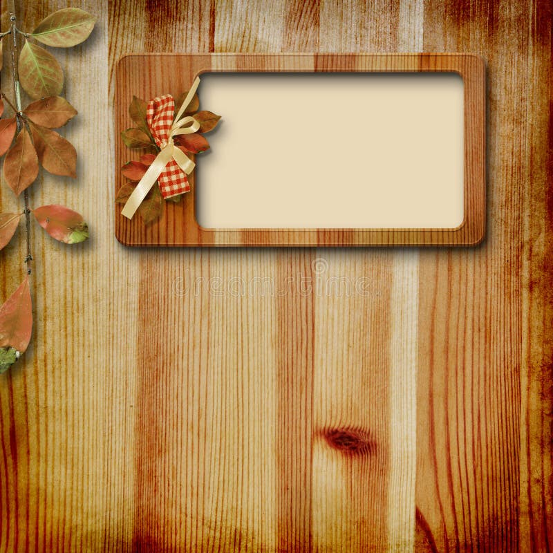 Wooden frame with autumn leafs