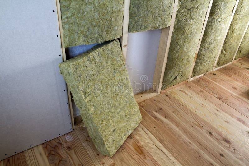 Wooden frame for future walls with drywall plates insulated with rock wool and fiberglass insulation staff for cold barrier. Comfortable warm home, economy, construction and renovation concept.