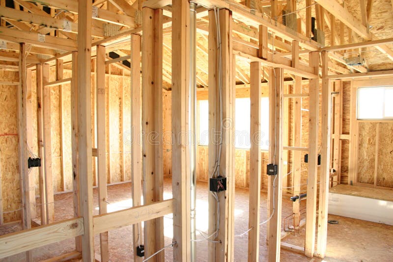 Interior of a new house under construction, wooden framework. Interior of a new house under construction, wooden framework.