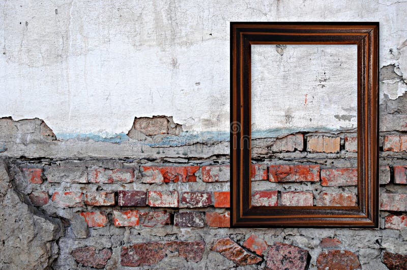 Wooden frame over grunge brick wall