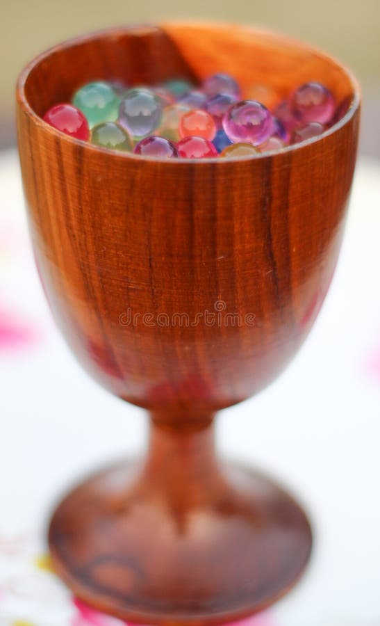 Wooden glass with jelly balls. royalty free stock image Wooden glass with jelly balls. royalty free stock image