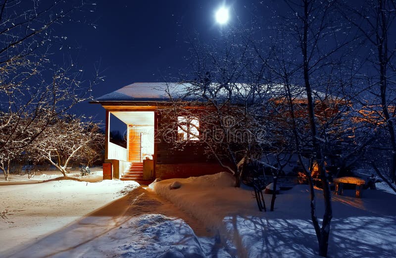 Wooden house in winter forest. night. moonlight