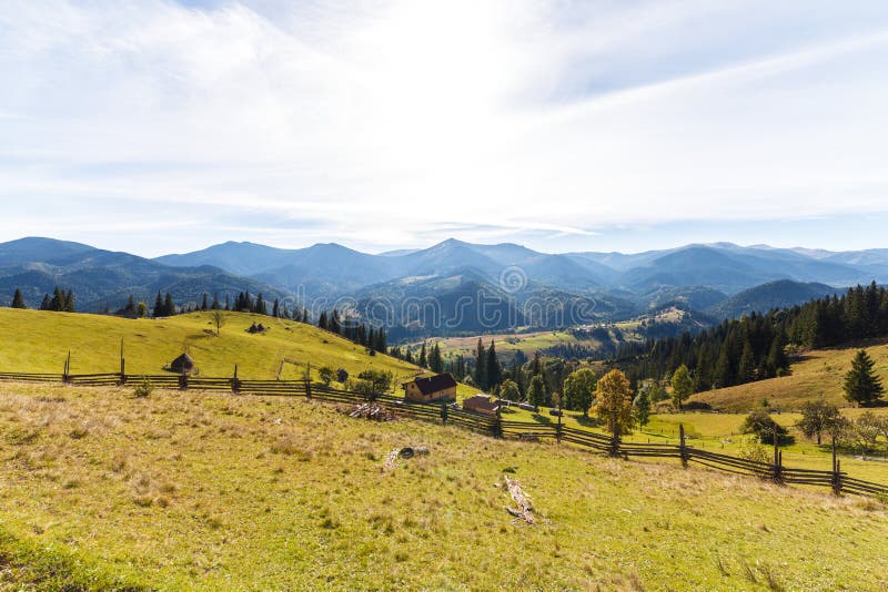 Green Grass Field Near Houses And Mountain Picture Image 106364045