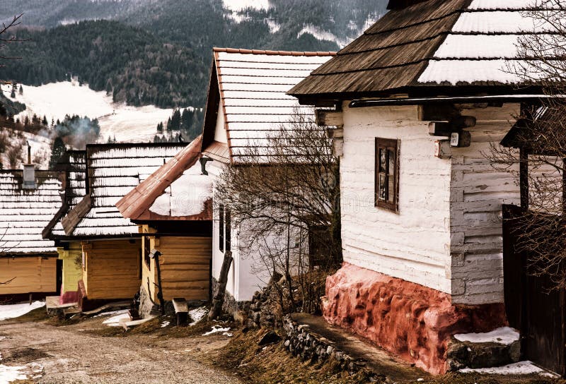 Wooden houses in Vlkolinec village, Slovakia, yellow filter