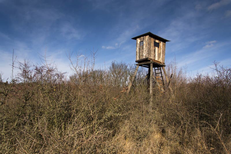 Wooden hunters high seat hide in forest