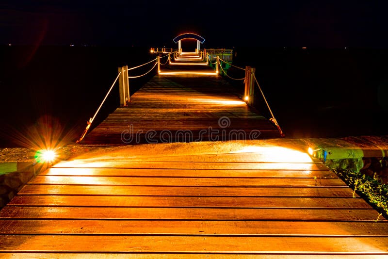 Wooden jetty in night scene