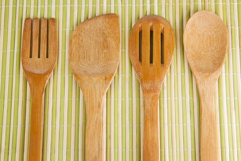 Row of assorted wooden kitchen utensils Stock Photo by ©oocoskun