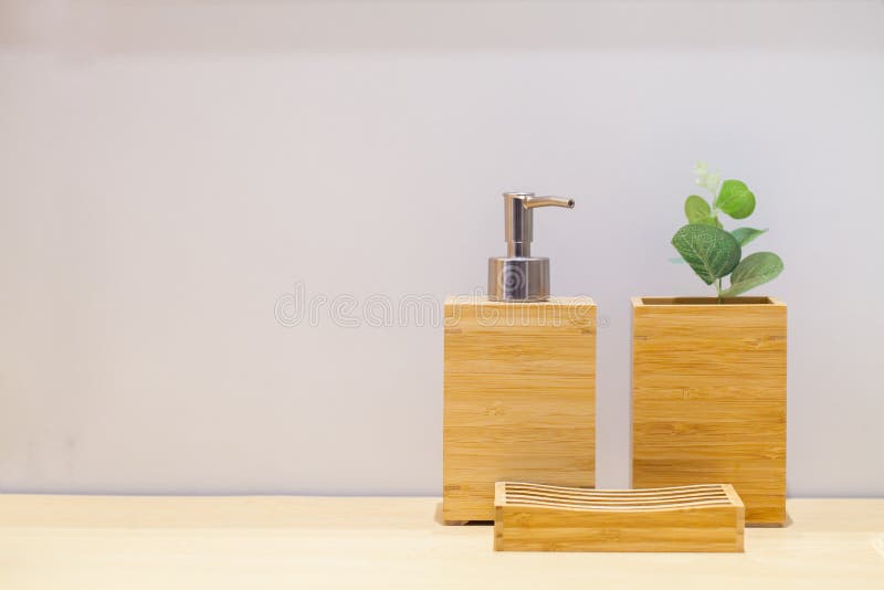 Wooden liquid soap bottle with small tree and soap pad . Bathroom Cosmetics. Bathroom accessories. Hygiene concept.